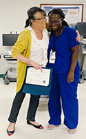 Two VA nurses hugging