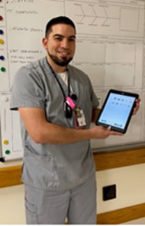 VA clinician holding a device