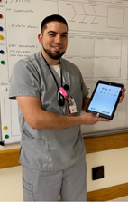 VA nurse holding a tablet
