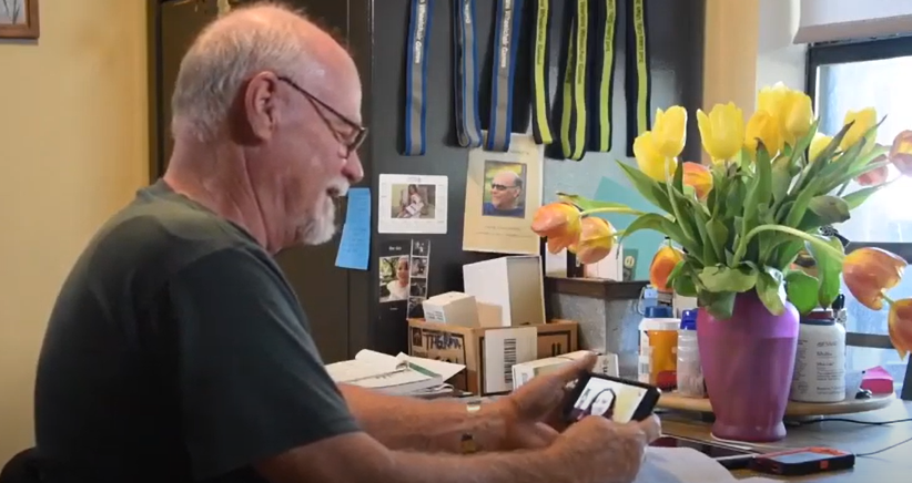 Veteran using phone to communicate with his doctor